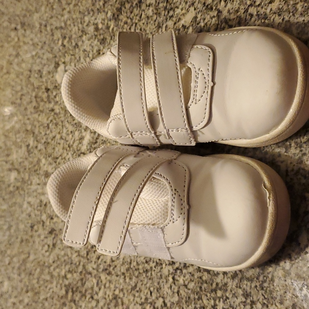 Girl's slip on white tennis shoes